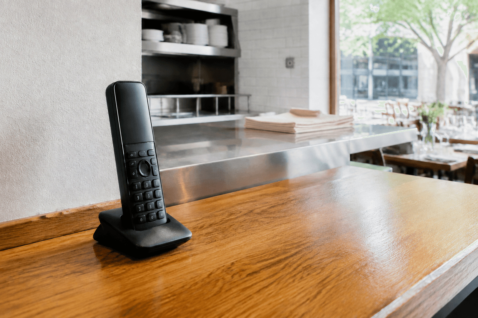 Illustrative restaurant telephone beside a kitchen pass