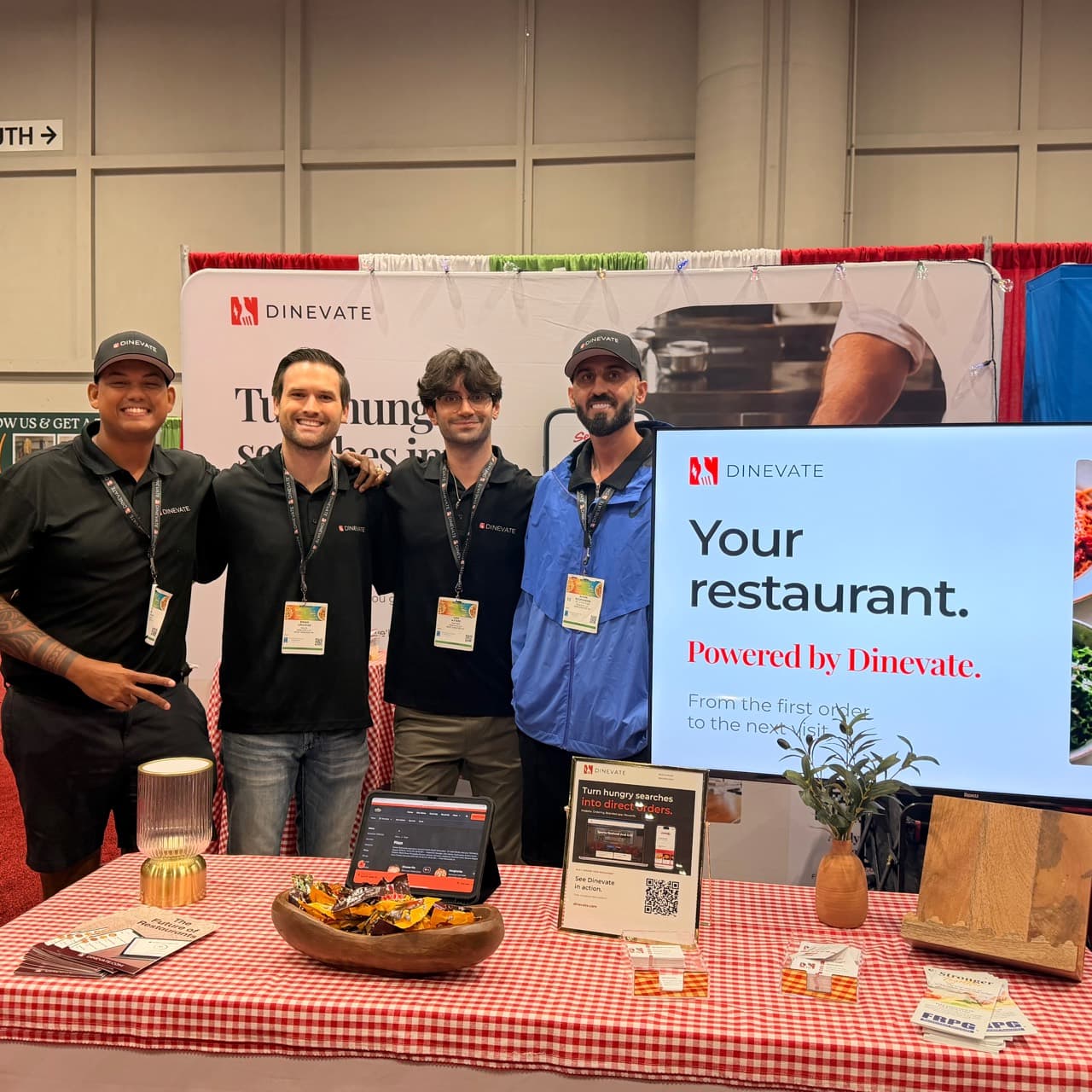 Four members of the Dinevate team together at the Pizza Tomorrow Summit booth