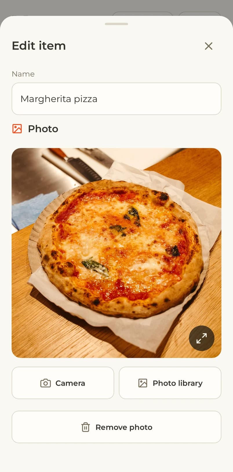 Adding a menu item photo from the camera or photo library, shown in a Google Pixel mockup
